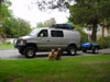 Zeke and Daisy next to van